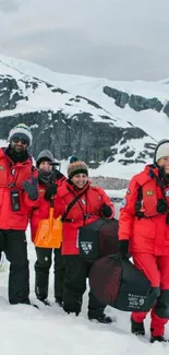 Group of explorers in red gear on snowy expedition.