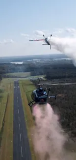 Helicopters and plane performing stunts over a scenic runway.