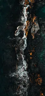 Aerial view of rocky shoreline with ocean waves crashing along the coast.