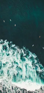 A beautiful aerial view of ocean waves crashing.