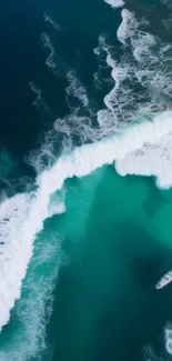 Aerial view of turquoise ocean waves with a boat.