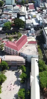 Aerial view of diverse urban cityscape with buildings and greenery.