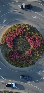 Aerial view of floral themed roundabout in urban setting.