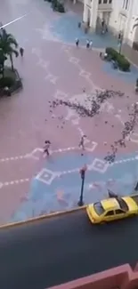 Aerial urban scene with birds and a yellow taxi in a geometric plaza.