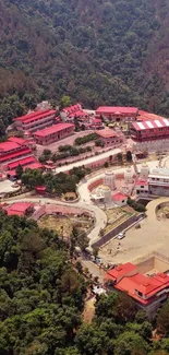 Aerial view of a colorful village with lush greenery and unique architecture.