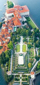 Aerial view of a lakeside island with gardens and architecture.