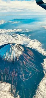 A breathtaking view of a volcano from an airplane window.