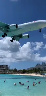 Airplane landing near beach with people watching.
