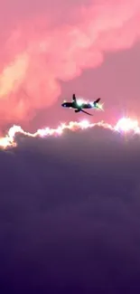 Airplane flying through vibrant pink and purple clouds.