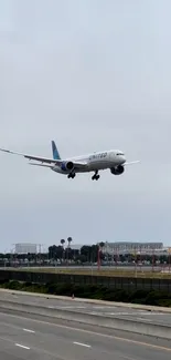 United airplane landing against a blue sky.