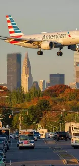 Airplane flying over city skyline with traffic below.