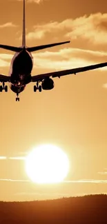 Airplane silhouette flying across a golden sunset sky.