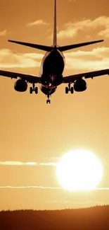 Airplane silhouetted against a golden sunset sky.