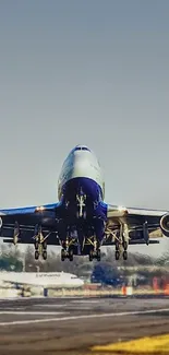 Airplane taking off on a clear day against blue sky backdrop.