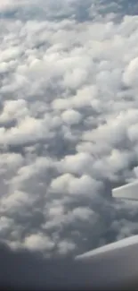 View of clouds from an airplane window, capturing the serene beauty of the sky.