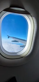 View from airplane window with sky and clouds.