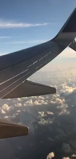 Airplane wing above clouds with a sunset view, ideal mobile wallpaper.