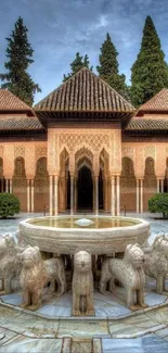 Alhambra courtyard fountain surrounded by ornate stone lions and lush greenery.