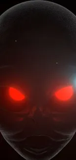 Alien face with glowing red eyes in a dark, mysterious setting.