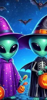 Cute aliens in Halloween costumes with pumpkins and bats under a starry sky.