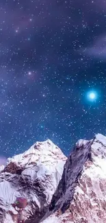 Alien ship above snowy mountain night sky wallpaper.