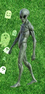 Alien with ghosts on grass background wallpaper.