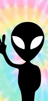 Alien silhouette with peace sign on a tie-dye background.