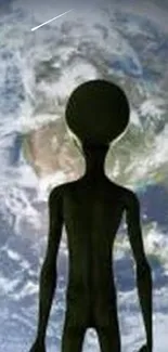 Alien silhouette against Earth in space wallpaper.