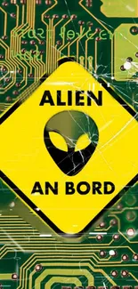 Alien caution sign on a green circuit board background wallpaper.