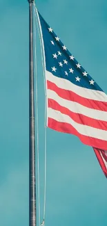 American flag against a clear blue sky.