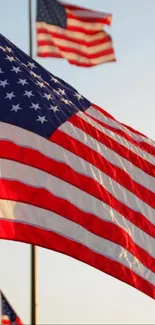 Vibrant American flag with red, white, and blue stripes waving.