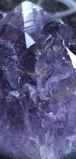 Close-up of amethyst crystal showcasing its natural purple hues and facets.