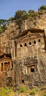 Ancient tombs carved into a rocky cliff.