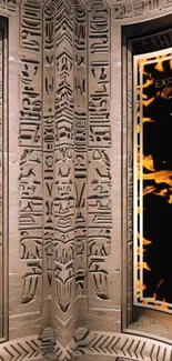 Ancient Egyptian hieroglyphics with flaming wings on stone texture.