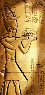 Ancient Egyptian hieroglyphs in golden tones on a pillar.