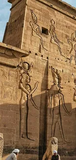 Ancient Egyptian temple with intricate stone carvings and hieroglyphs.