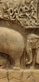 Intricate stone carving of elephants in ancient art style.