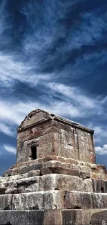 Ancient stone monument under a vivid blue sky.