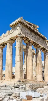 The Parthenon under a bright blue sky with ancient stone columns in Athens, Greece.