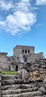 Ancient stone ruins beneath a vibrant blue sky.