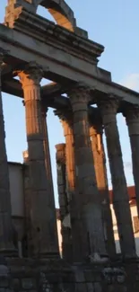 Stunning ancient temple with stone columns at sunset.