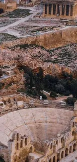 Aerial view of ancient theatre with cityscape backdrop.