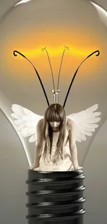 Angel with wings inside a glowing light bulb.