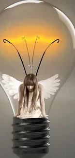 Angel figure inside a glowing lightbulb on a gray background.