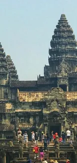 Angkor Wat temple with tourists in front.