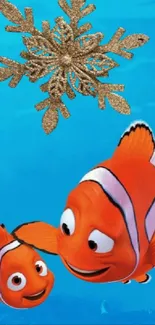 Vibrant underwater wallpaper with clownfish and a golden snowflake.