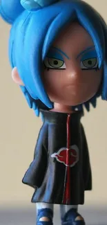 Anime figurine with blue hair and black outfit.