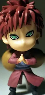 Anime figurine with brown hair and vibrant colors, hands clasped.