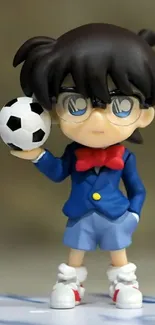 Anime character in blue suit holding a soccer ball, wearing glasses.