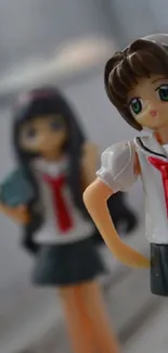 Two anime-style figures in school uniforms on a blurred background.